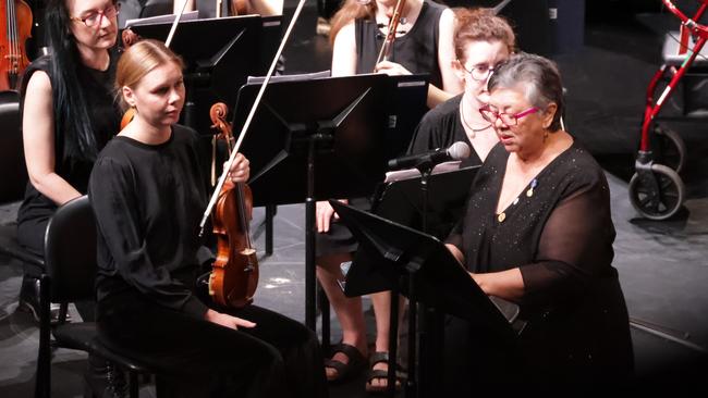 Aunty B addresses the audience ahead of the premiere. Gurrulwa Guligi (Big Wind) by Bilawara Lee and Netanela Mizrahi, a reflection on Cyclone Tracy 50 years after it devastated Darwin, was premiered by the Darwin Symphony Orchestra in 2024. Picture: Darwin Symphony Orchestra.