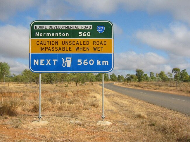 Road sign at Chillagoe. picJohn/Wright roads qld travel tourism outback signs Burke Development Road highway 27 "Caution unsealed road impassable when wet - Next fuel 560km - Normanton 560"