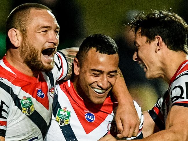 Sio Siua Taukeiaho of the Roosters (centre) reacts after scoring a try during the Round 19 NRL match between the Manly-Warringah Sea Eagles and the Sydney Roosters at Lottoland in Sydney, Sunday, July 22, 2018. (AAP Image/Brendan Esposito) NO ARCHIVING, EDITORIAL USE ONLY