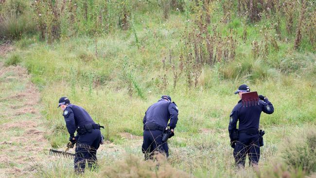 Police pictured doing a line search on a property off Hazelton Road in Bungonia, as part of the ongoing investigation by Strike Force Ashfordby. Picture: NCA NewsWire / Damian Shaw