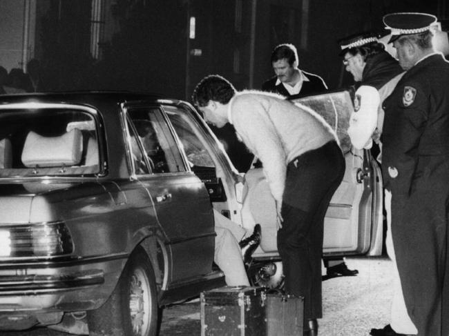 Police inspect Anthony Eustace’s Mercedes after he was shot dead in Gertrude Street, Arncliffe in 1985. Picture: Anthony Weate 