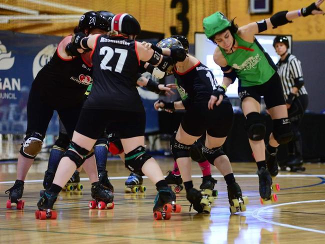 The Derby Dolls from the Runaway Bay Sports Centre are looking for new roller derby members. Photo by Richard Tompsett.