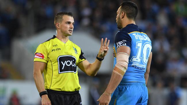 Referee Grant Atkins speaks with Titans captain Ryan James during the Round 14 match between the Gold Coast and South Sydney. Picture: AAP