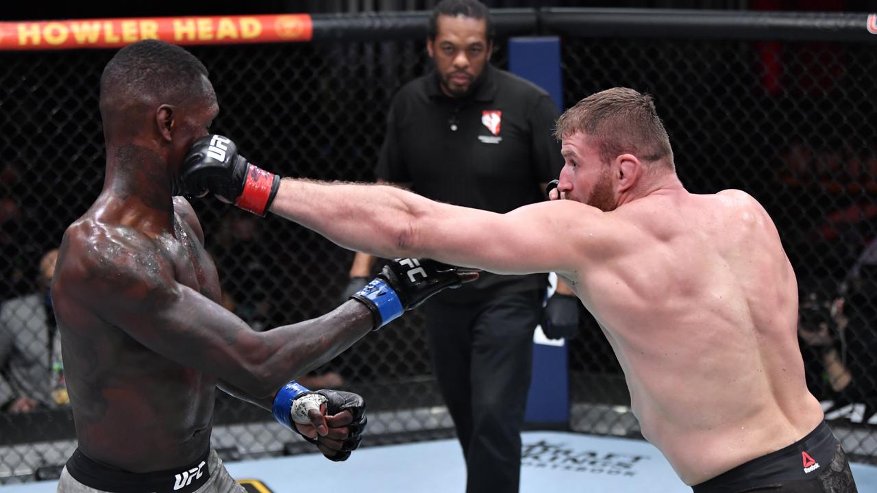 Jan Blachowicz lands on Israel Adesanya during their title bout at UFC 259. (Photo by Jeff Bottari/Zuffa LLC)