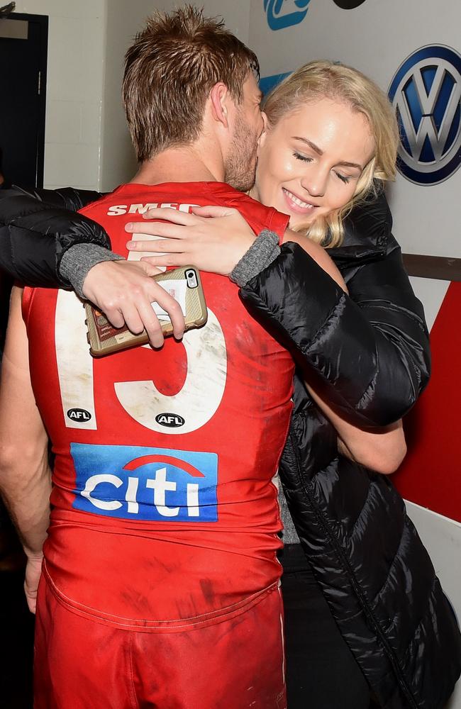 Kieren Jack gets a hug from partner Charlotte Goodlet after his 200th game. Picture: Jay Town