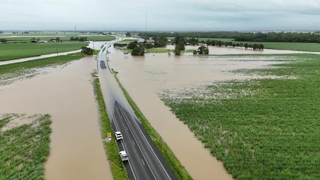 Flood water covers the Bruce Highway at Euramo, south of the Tully River, the furthest south the Far North Queensland residents can currently travel by road. Picture: Brendan Radke