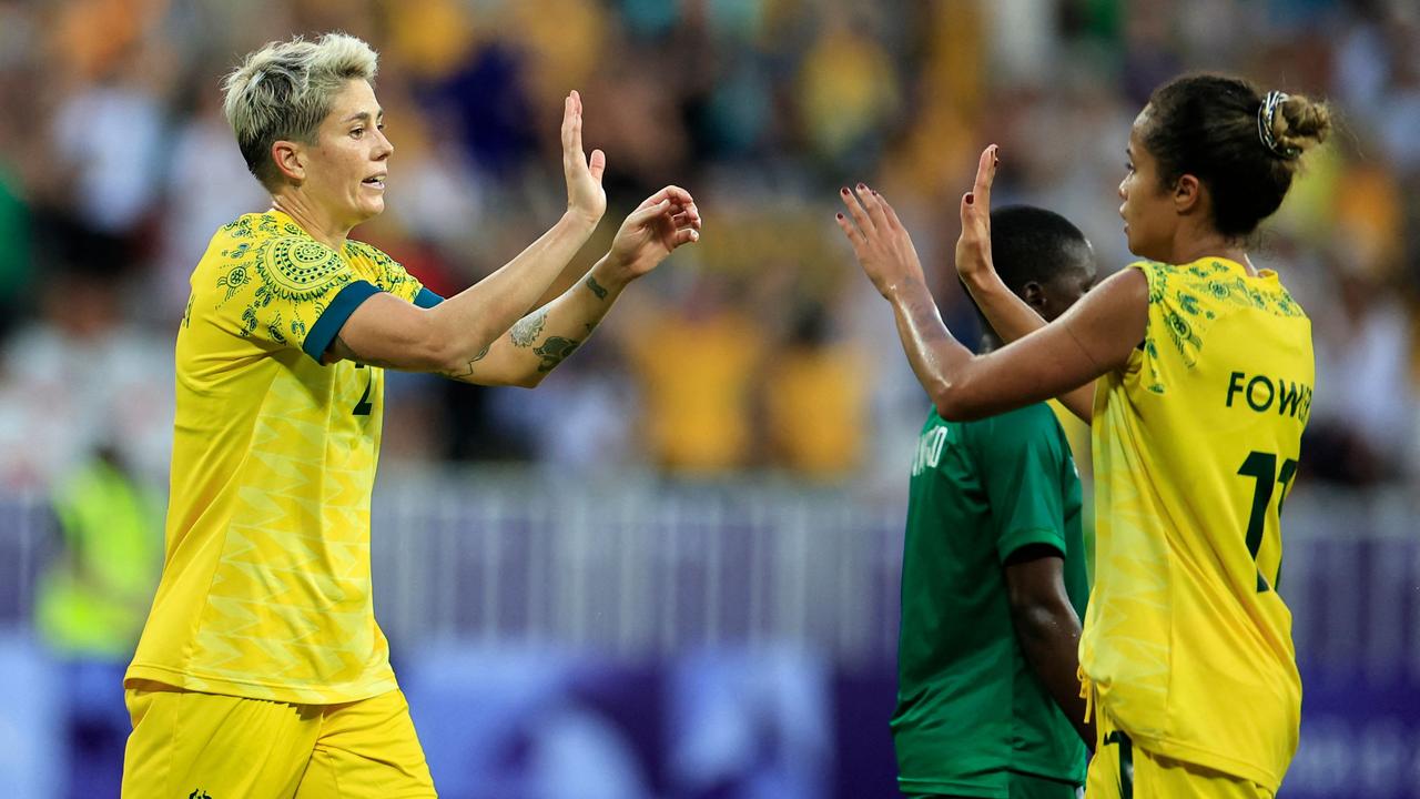 Michelle Heyman (left) celebrates with Mary Fowler after scoring at the Olympics. Picture: Valery Hache / AFP