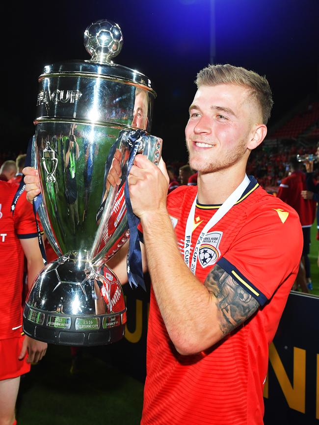 Riley McGree with the FFA Cup following the Reds’ thumping of Melbourne City. Picture: Mark Brake/Getty Images