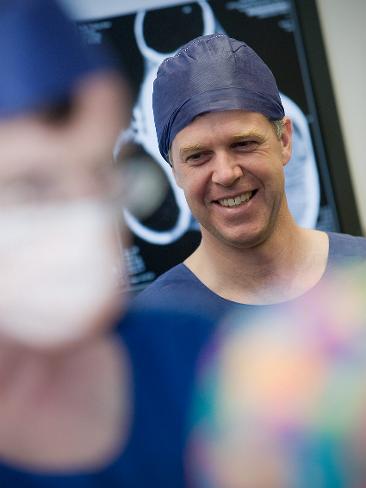 <p>Plastic surgeon Andrew Greensmith inside the operating theatre. Picture: RCH</p>