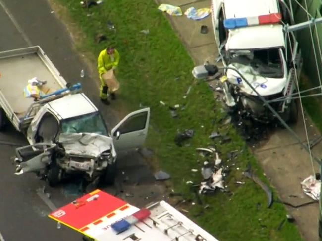 Two cars, including a marked police van, involved in a head-on collision at Caboolture.