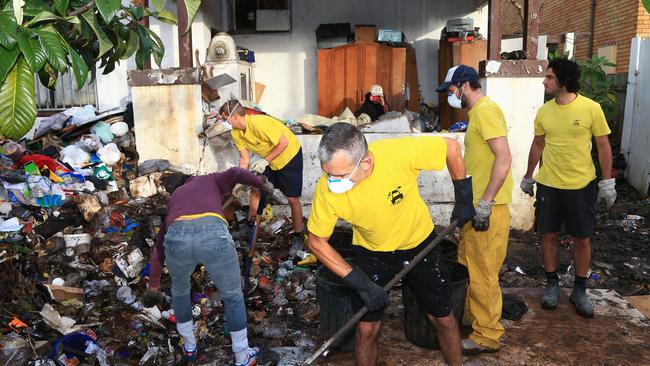 Council and contract workers clean up the Bobolas house following the drafting of new laws against hoarding. Picture: Adam Taylor