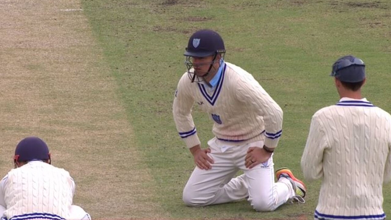 Moises Henriques fields on his knees on day three.