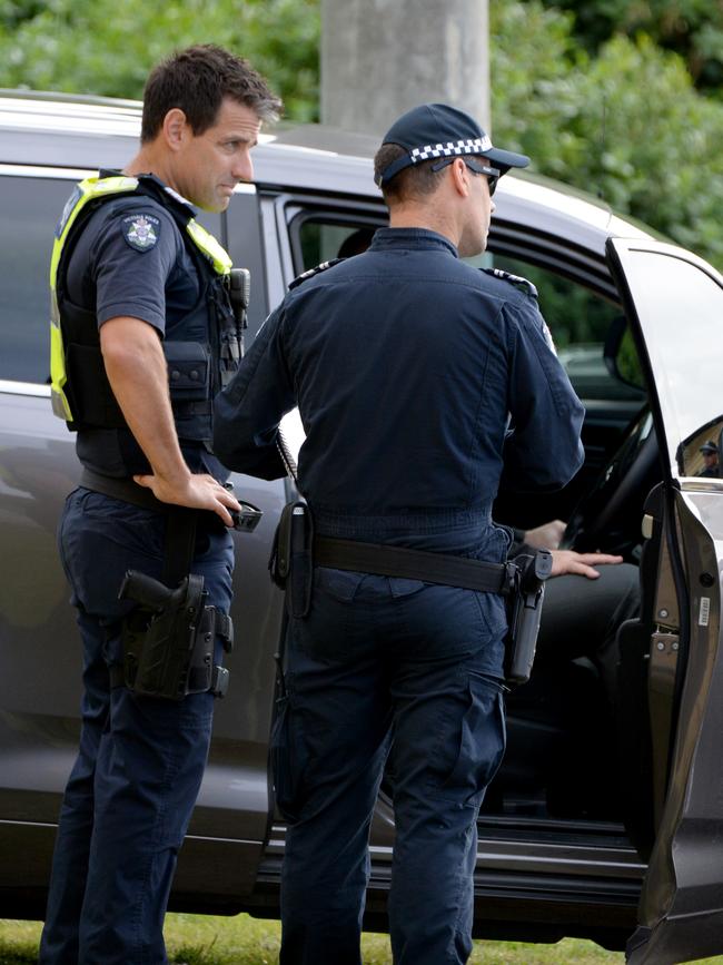 Police at the scene of the search. Picture: Andrew Henshaw