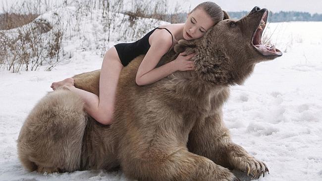 Bear-back: Lidia Fetisova gest up close with a bear for this photoshoot. Pic: Olga Barantseva/ Caters News