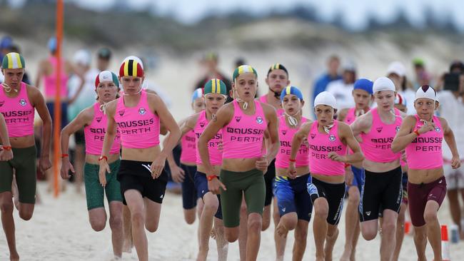 Racing in the 2km beach run at the youths.