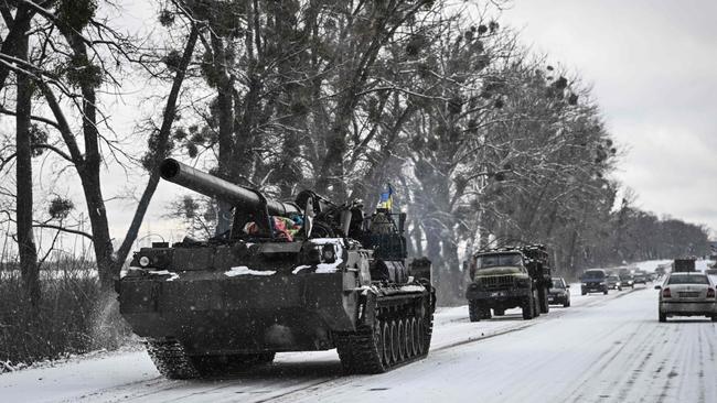 An Ukrainian tank rolls along a main road near Kyiv. Picture: AFP