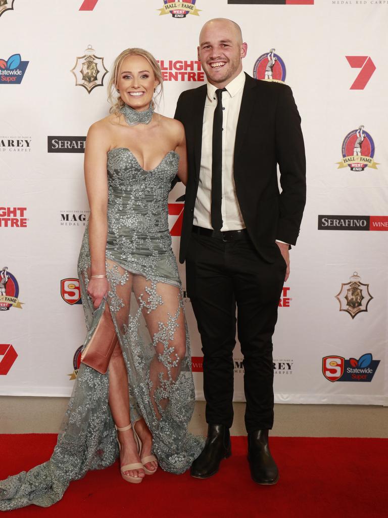 Brooke Chaplin waering ONS Boutique, and Zane Kirkwood pose for a picture on the red carpet at Adelaide Oval in North Adelaide, for the Magarey Medal, Monday, September 9, 2019. Picture: Matt Loxton