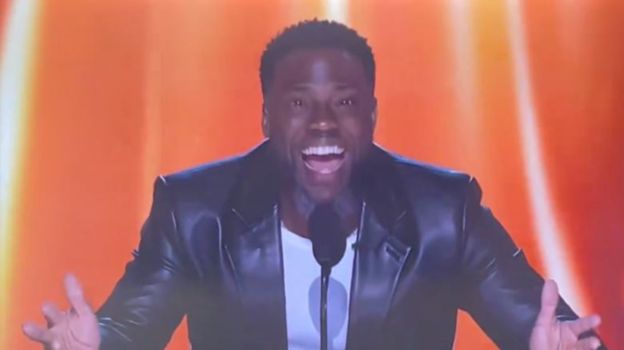 Kevin Hart roasts Tom Brady during “The Roast of Tom Brady” on Netflix.