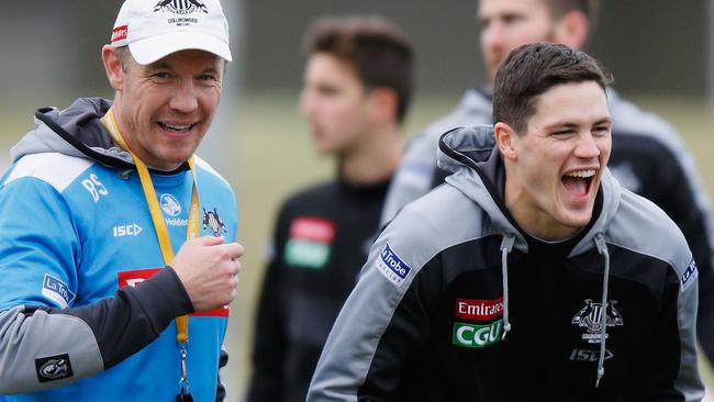 Jack Crisp has a laugh with assistant coach Brenton Sanderson.