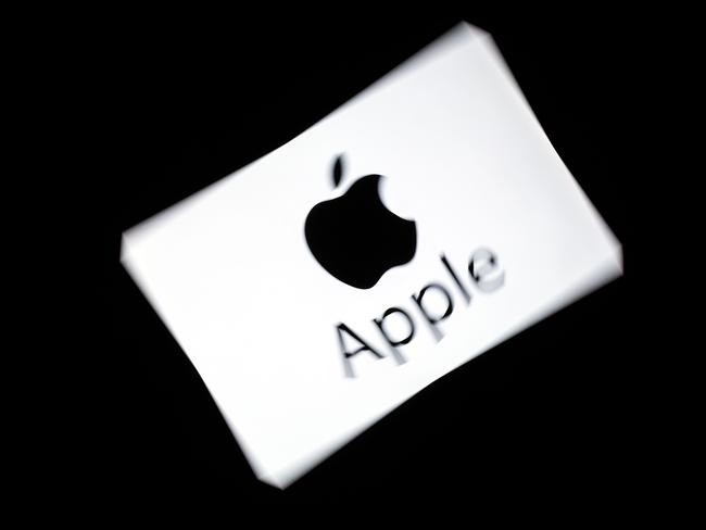 (FILES) In this file photo taken on February 18, 2019 US multinational technology company Apple's logo is displayed on a tablet in Paris. - French Senate approved in the night between May 22 and May 23, 2019 a new tax on digital giants ("Gafa"), such as Google, Amazon, Facebook and Apple, carried through Finance Minister Bruno Le Maire. (Photo by Lionel BONAVENTURE / AFP)