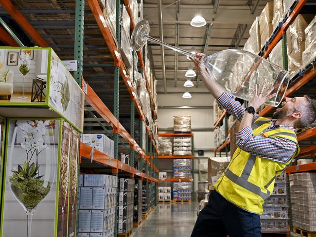 Costco Ipswich Warehouse Manager Nick Weller with a giant wine glass.