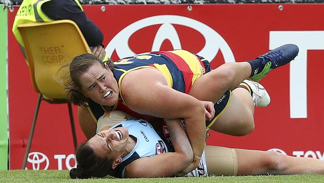 Sarah Perkins lays a crunching tackle on Laura Attard. Picture: Sarah Reed