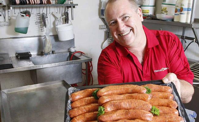 Owner of Circle T Meats Barnie Nolan with his award-winning sausages at his Raceview butcher shop. . Picture: Sarah Harvey