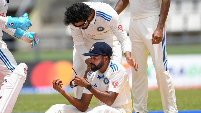 Is that India’s cricket shirt or Liverpool away to Chelsea? (Photo by Randy Brooks / AFP)