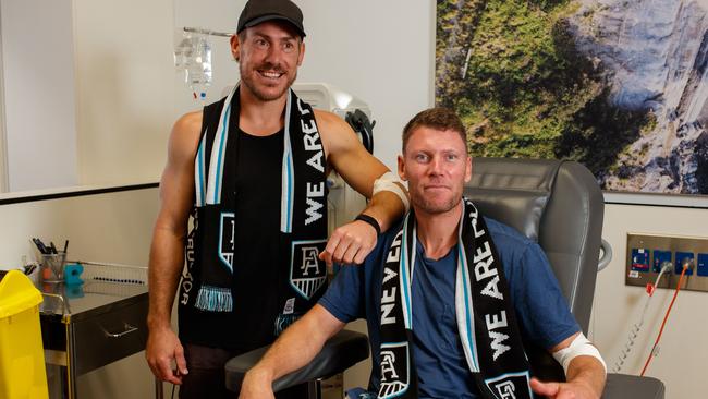 Brett Ebert, left, and Brad Ebert donating blood last year. Picture: Matt Turner.