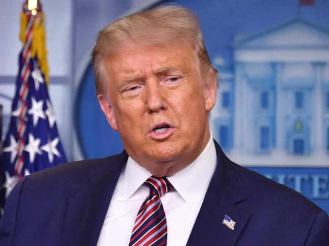 US President Donald Trump answers questions during a news conference in the Brady Briefing Room of the White House in Washington, DC, on August 12, 2020. (Photo by Nicholas Kamm / AFP)