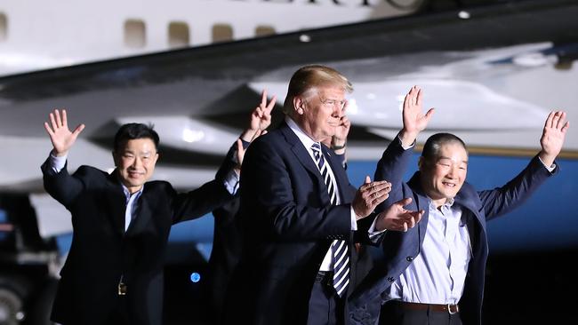 Donald Trump welcomes home three Americans released by North Korea. Picture: AFP