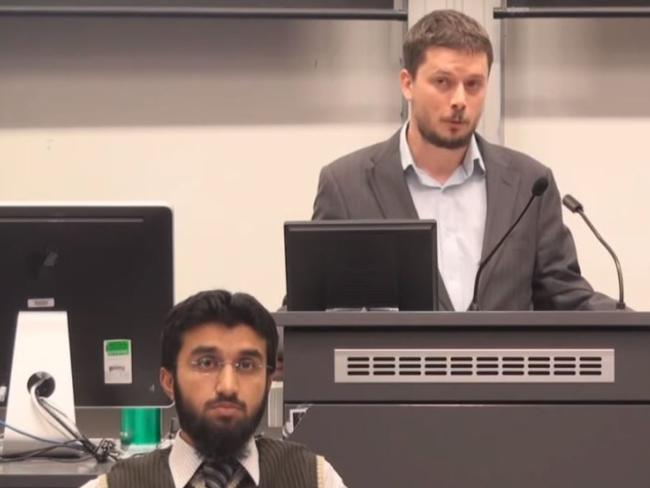 Labor candidate for Farrer Christian Kunde, right, appears in a video of a moderated debate on the belief in God held at the Australian National University in 2012 alongside Uthman Badar, official spokesman for Hizb ut-Tahir.