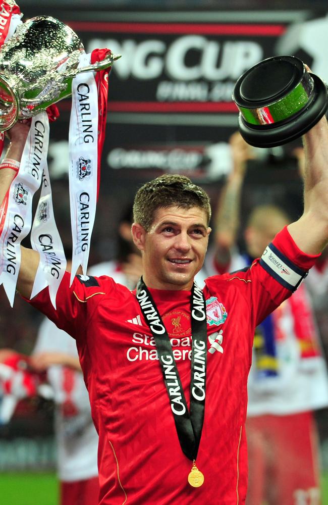 Steven Gerrard celebrates with the 2012 League Cup.