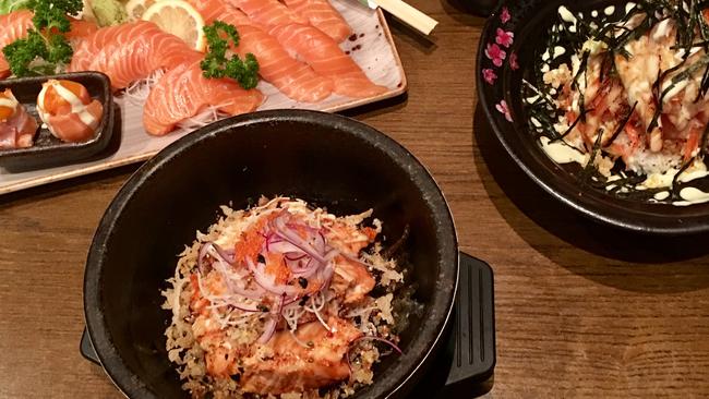 Mira’s sizzling salmon (front), salmon and salmon and Manly Tower.