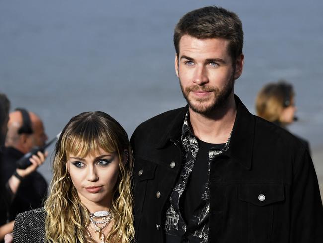 Miley Cyrus and Liam Hemsworth pictured at Malibu shortly before they split. Picture: Getty