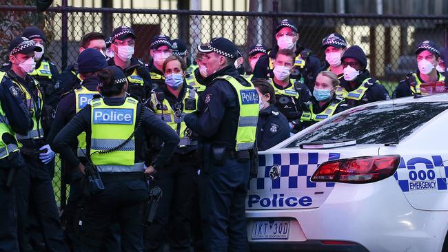 A heavy police presence was soon on scene after nine public housing towers in Melbourne’s inner north and west were forced into lockdown. Picture: Ian Currie