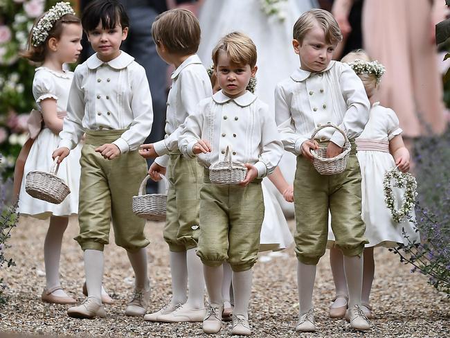 Prince George holds his petal basket along with the other kids. Picture: AFP PHOTO / Justin TALLIS