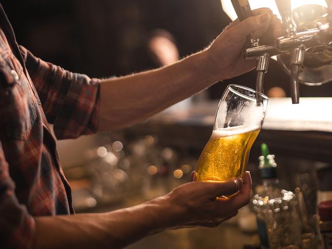 Bartender pureeing beer from a tap