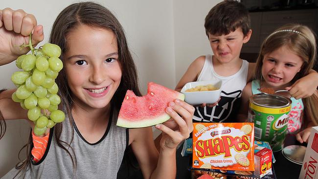 Parents should not force their kids to eat good food, argue at mealtimes or use unhealthy food as bribes, experts have found. Having separate mealtimes, giving kids only the food they like and limiting their food choices are all linked to unhealthy eating. Ciara, 10, Luke, 7, and Brooke, 5. Picture: Alex Coppel