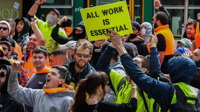 CFMEU protestors are seen shouting towards police as thousands march through Melbourne. Picture: Getty Images