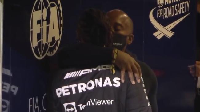 Anthony Hamilton comforts his son Lewis after the Abu Dhabi Grand Prix. Picture: Supplied