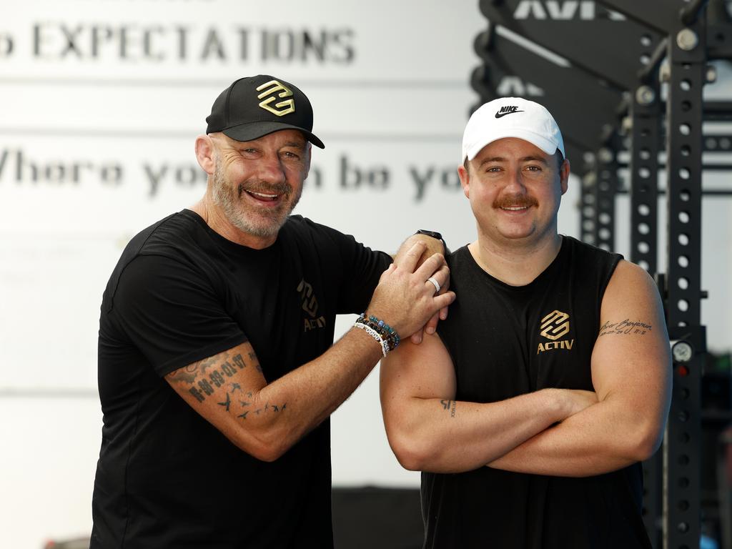 Geyer and his son, Logan, at the family's gym in Penrith. Picture: Jonathan Ng