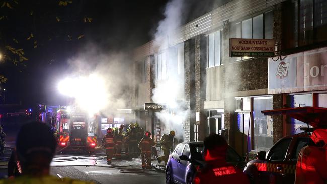 The Fadez Barbershop was found well alight after a car rammed into the store and a man raced into the store. Picture: Bill Hearne