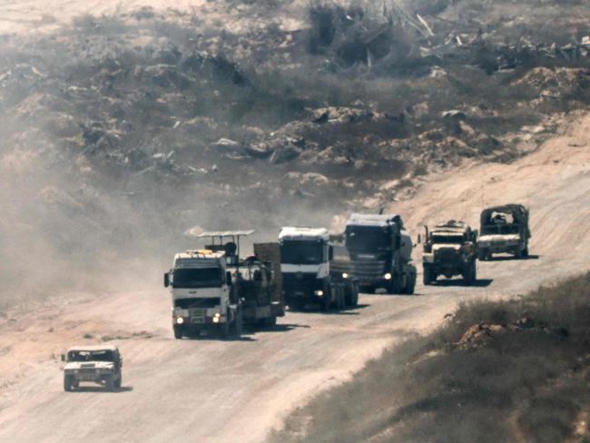 A convoy of Israeli civilian and military vehicles drives through the Gaza Strip on July 2. Picture: AFP