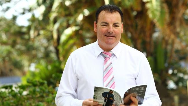  Bali bombing survivor Andrew Csabi with his book 'Bom Bali — Life after Death — Ten Years On'.