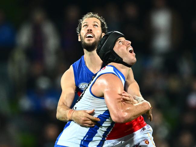 Darcy Fort and Tristan Xerri grapple on Sunday night. Picture: Steve Bell/Getty Images.