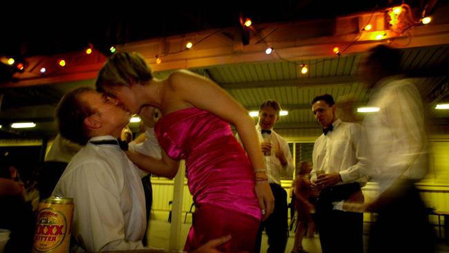 DECEMBER 31, 2000 : Ben Ward kisses Alex Harris at Bachelor & Spinster (B&S) Ball in Brisbane as they celebrate NYE, 31/12/00. Pic Patrick Hamilton. Queensland / New Year's Eve