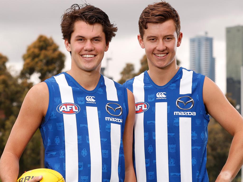 MELBOURNE, AUSTRALIA - NOVEMBER 28: North Melbourne draftees Joel Crocker (right) and Curtis Taylor (left) pose for a photograph during a North Melbourne Kangaroos AFL media opportunity opportunity at Arden Street on November 28, 2018 in Melbourne, Australia. (Photo by Michael Willson/AFL Media/Getty Images)