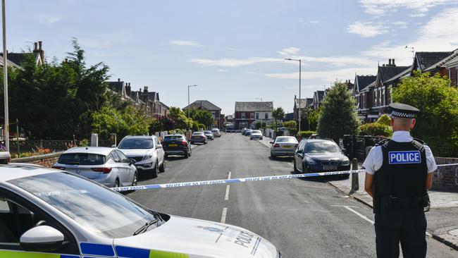 A police officer stands near a cordoned off street after the stabbing attack. Picture: Getty Images.