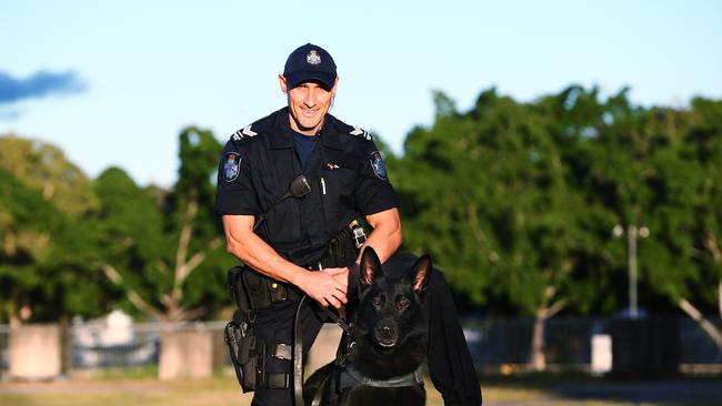 Senior Constable Adrian Marek with his dog Bally. PICTURE: BRENDAN RADKE